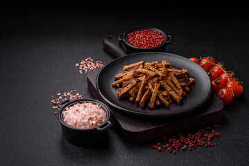 Crispy homemade brown bread crackers or croutons with seeds and grains