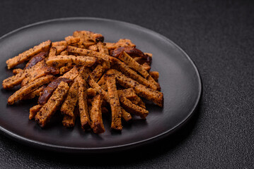 Crispy homemade brown bread crackers or croutons with seeds and grains