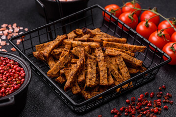 Crispy homemade brown bread crackers or croutons with seeds and grains