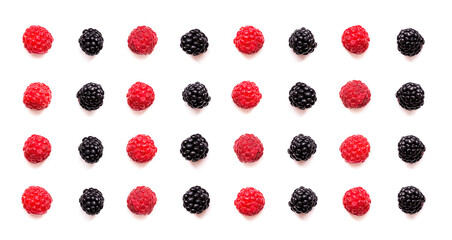 Fresh raspberries and blackberries arranged in a neat pattern on a white background showcasing their vibrant colors and textures