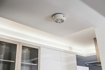 Modern home interior with ceiling smoke detector for safety and security.