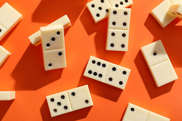White dominos blocks on orange background