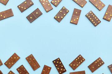 Many wooden dominos blocks on blue background