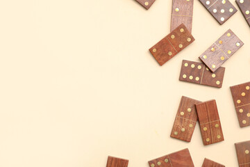 Wooden dominos blocks on beige background