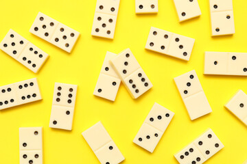 White dominos blocks on yellow background