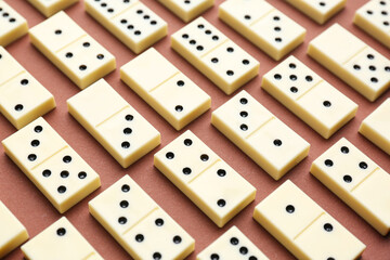Texture of white dominos blocks on brown background