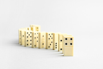 Many white dominos blocks on grey background