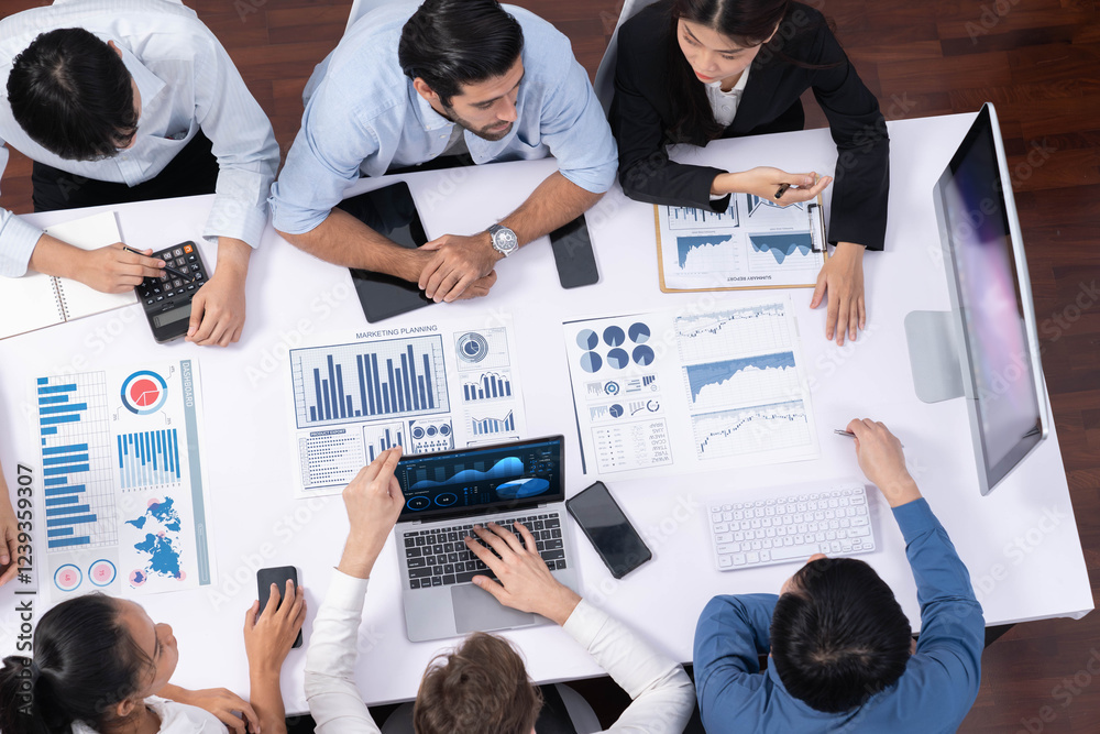 Fototapete Top view analyst team utilizing BI Fintech to analyze financial data at table in meeting room. Analytic BI dashboard power on paper for business insight and strategic marketing planning. Prudent