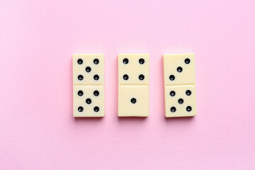 White dominos blocks on pink background