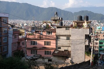 Scenery of roofs of buildings in Kathmandu with water tanks and solar panels, Nepal