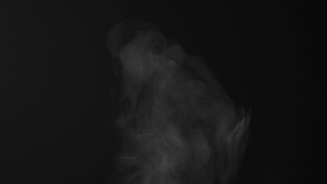 Steam, smoke, vapor isolated on black background. Smoke steam spray, abstract vaporing water, texture of cold mist, hot vapor, fog effect closeup, black screen. Hot food, drink. For overlay using. 