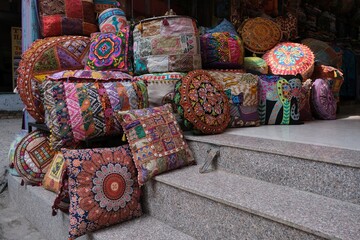 Shop with colorful pillows with ethnic patterns in a bazaar in Kathamndu, Nepal