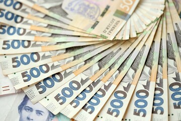 Big amount of different ukrainian hryvnia currency money bills in pile