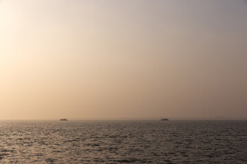Boats sailing at Sundarban tiger reserve during sunset, India