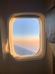 Naklejka premium view from airplane window to an ombré sky. 
