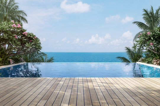 Modern contemporary style resort swimming pool terrace with sea view 3d render ,There has wooden floors surrounded by tropical style garden