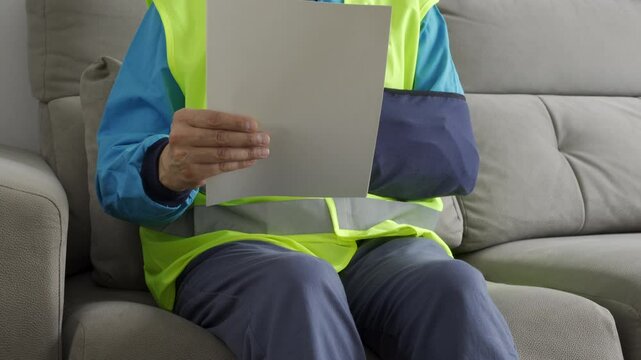 Reading letter about Injury and repairman compensation paperwork,insurance,legal contract or lawyer consulting. Disability people, attorney or advocate in negotiation, policy advice or accident report