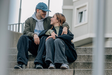 couple of boy and girl on the street outdoors hugging