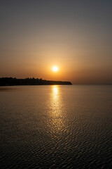 Naklejka premium Sunset over Greek coastline