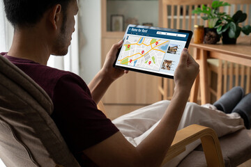 Online real estate rental search snugly on computer. House home or apartment rental website online.