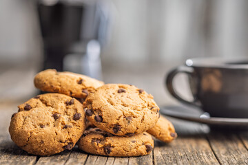 Chocolate chip cookies on wooden table.