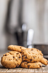 Chocolate chip cookies on wooden table.