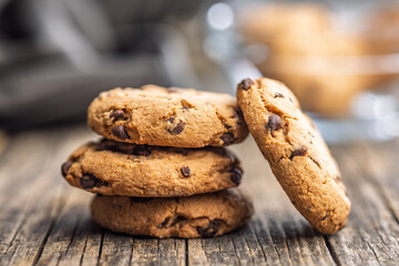 Chocolate chip cookies on wooden table.