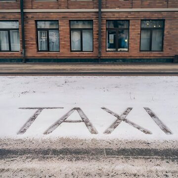 Taxi scrip written in the snow