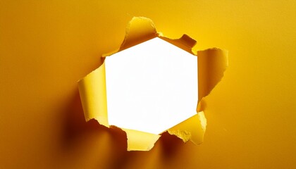 hole in the yellow paper isolated on white background