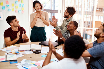 Meeting, group and applause for business woman, praise and congratulations on promotion in creative...