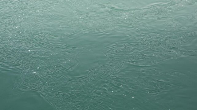 Calm flow of water in the river close up