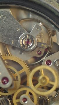 Cogwheels inside clockwork. Close-up. Concept Eternity, Teamwork , Idea Technology. Tick-Tick Sound