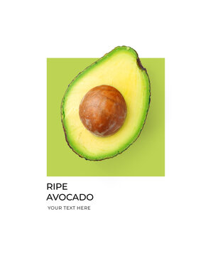 Creative layout made of green avocado on the green and white background. Flat lay. Food concept. Lemon on white background.