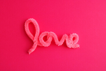 Pink word love with a plush texture