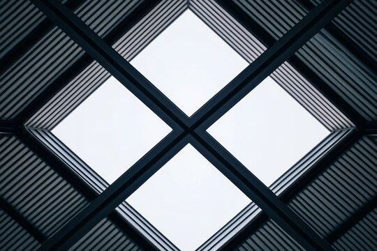 Geometric architectural roof design with symmetrical lines and clear sky