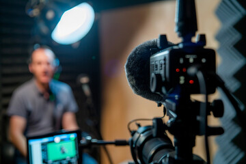 A confident man hosts a podcast from modern workspace, AI generated image