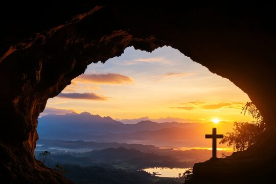 Scenic sunrise view from cave with cross overlooking mountain valley
