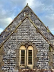 Historic stone chapel with arched windows