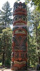 Ancient cedar totem pole with mythical creatures shiny surface sunlight filtering through trees