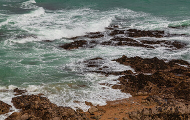 waves crashing on rocks