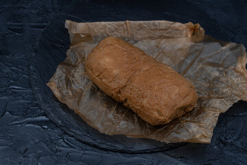 Seitan prepared at home out of wheat gluten and tapioca flour, sesame paste and spices, steamed. Copy space.