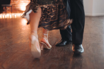 Dancing stiletto shoes of couples dancing traditional latin argentinian dance milonga in the...
