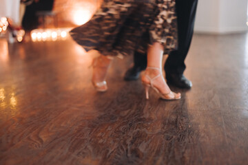 Dancing stiletto shoes of couples dancing traditional latin argentinian dance milonga in the...