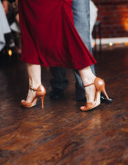 Dancing stiletto shoes of couples dancing traditional latin argentinian dance milonga in the...