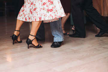 Dancing stiletto shoes of couples dancing traditional latin argentinian dance milonga in the...