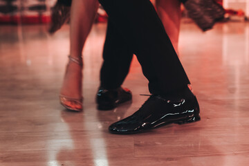 Dancing stiletto shoes of couples dancing traditional latin argentinian dance milonga in the...