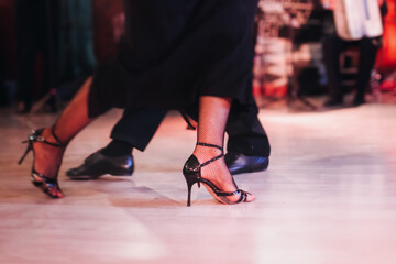 Dancing stiletto shoes of couples dancing traditional latin argentinian dance milonga in the...