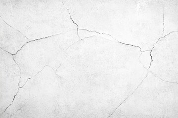 Texture of cracked white plaster wall surface with fissures