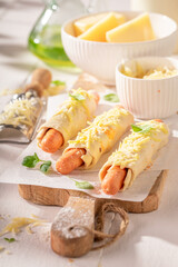Delicious hot dogs with puff pastry and cheese.