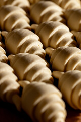 Deliciously Freshly Shaped Croissants Awaiting Their Time in the Oven Ready for Baking